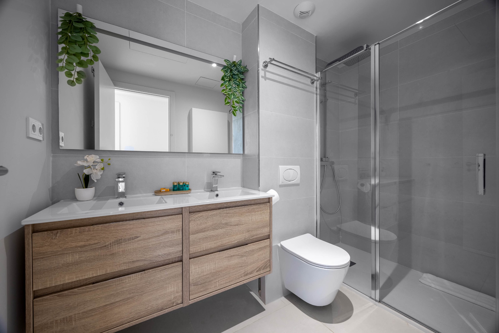 Bathroom two with double vanity and walk-in shower