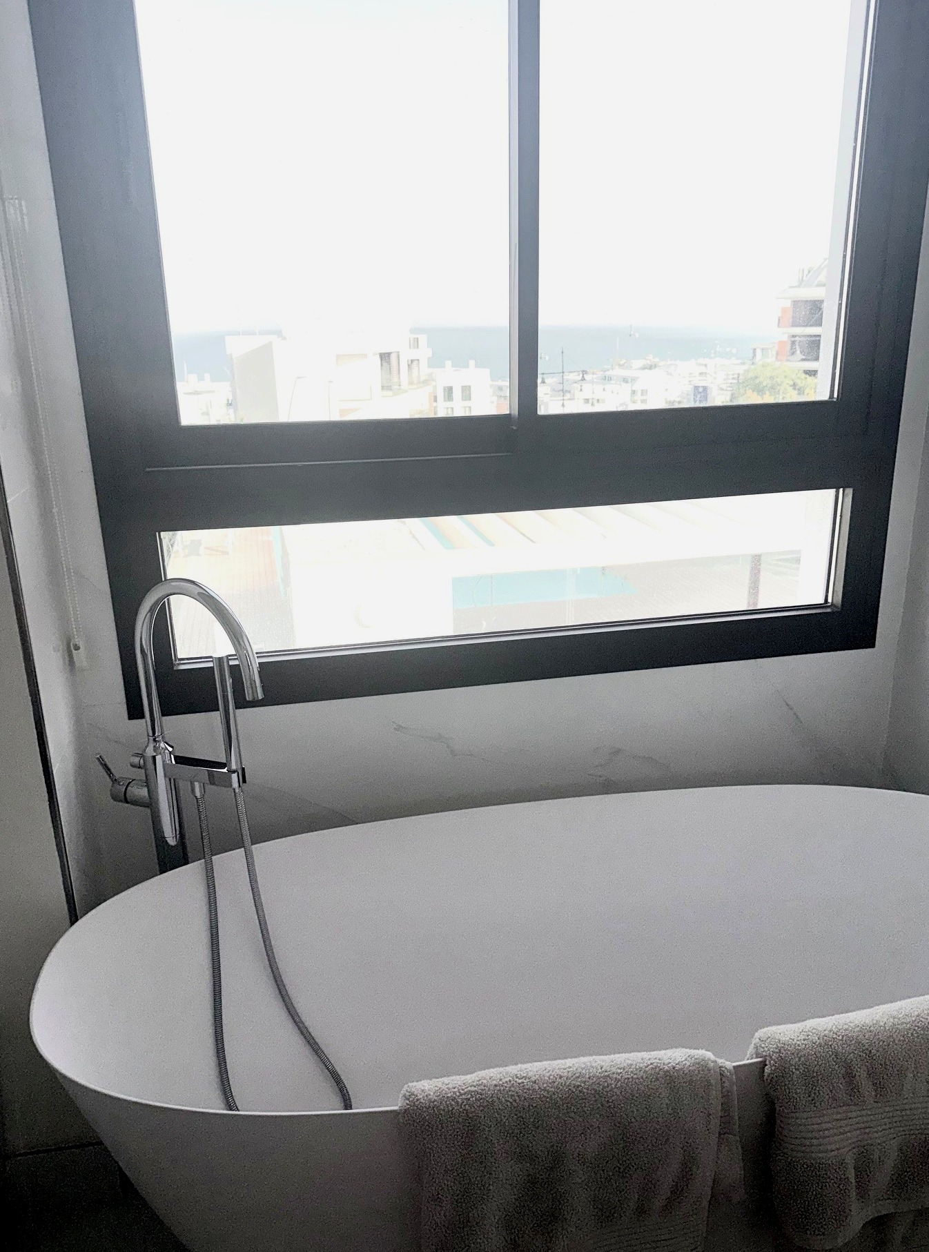 Freestanding bathtub with sea view from the master en-suite bathroom