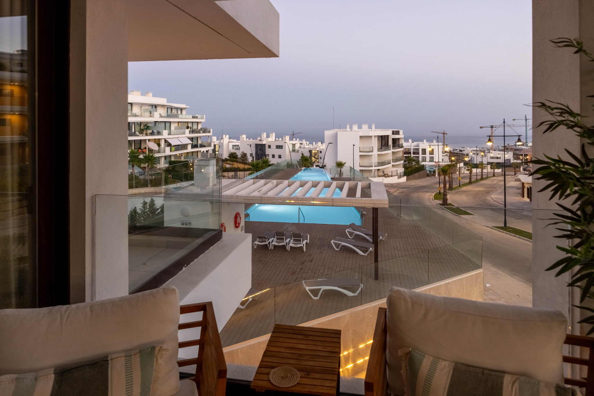 Pool and sea view at dusk